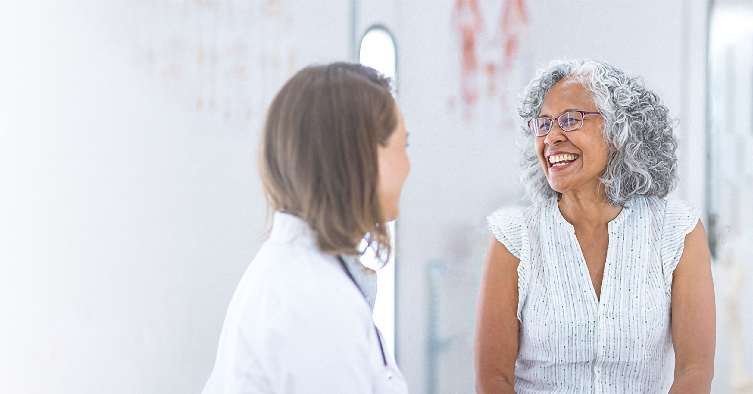 Patient smiling at doctor
