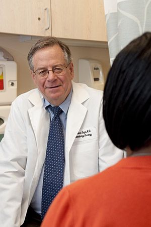 Robert Siegel talking to a patient 