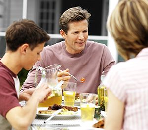 Family at the dinner table eating
