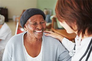 Health Provider helping a patient 