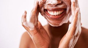 Woman washing her face