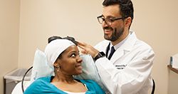 Doctor performing TMS therapy