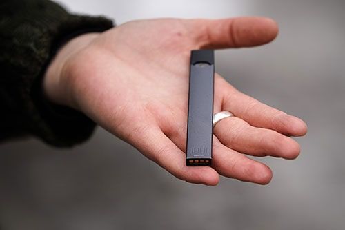 Hand holding a vape
