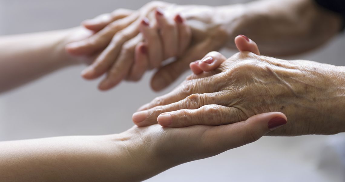 Young hands holding older hands