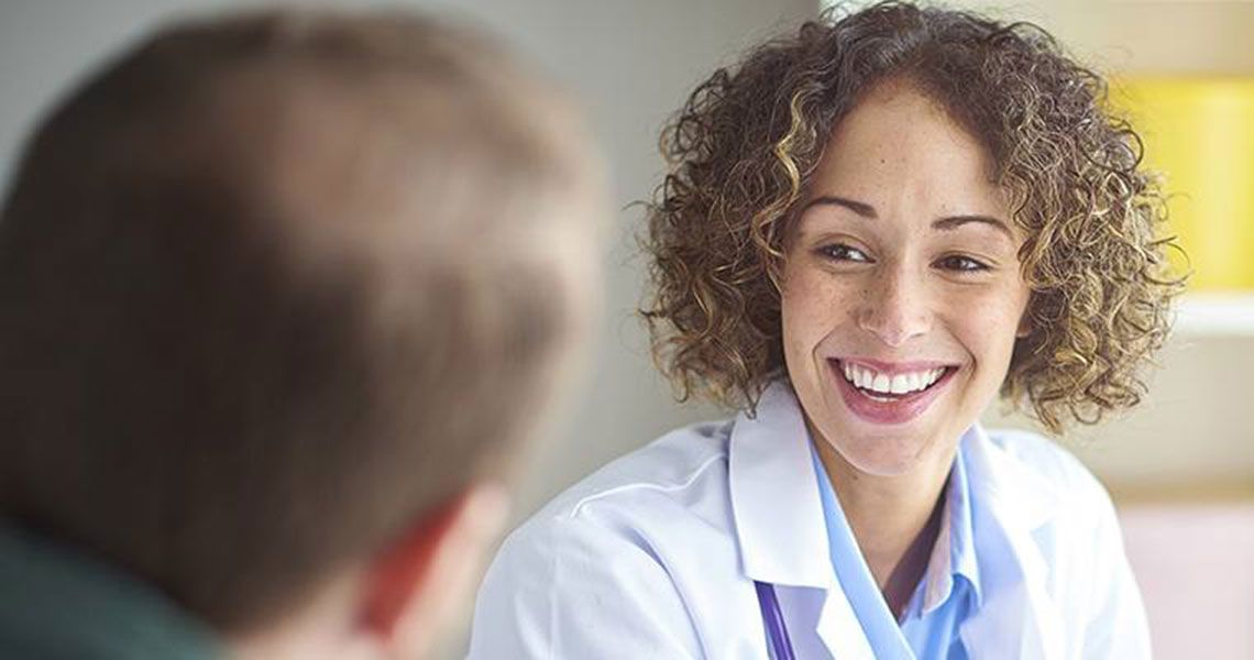 Doctor smiling at their patient