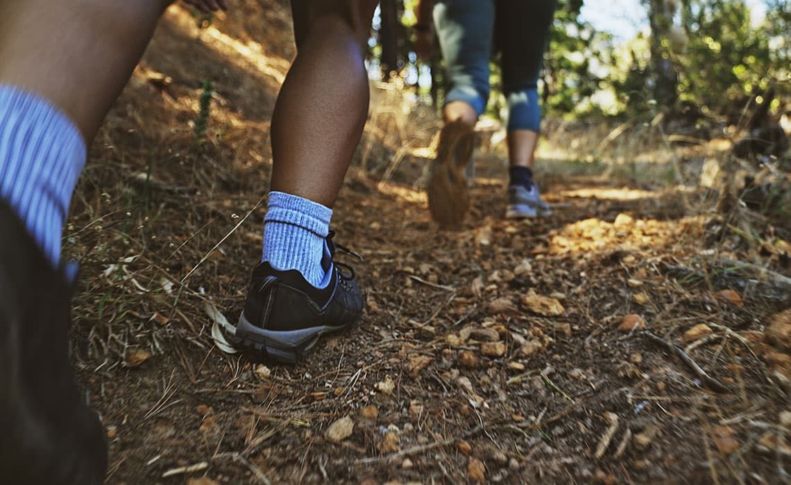 Two people hiking on a trail