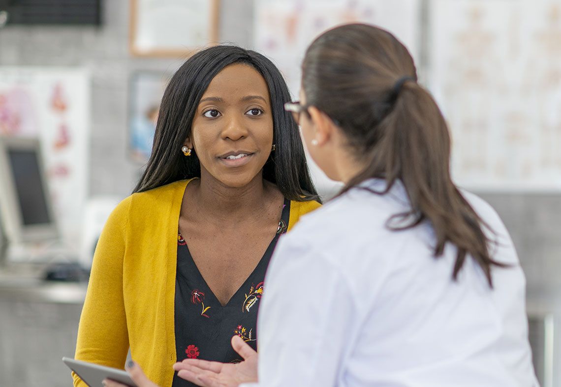 patient talking to doctor