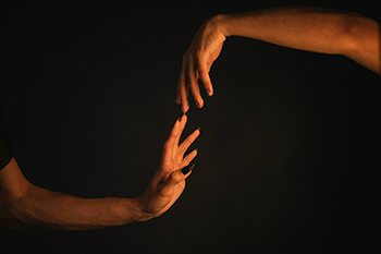 hands reaching for each other