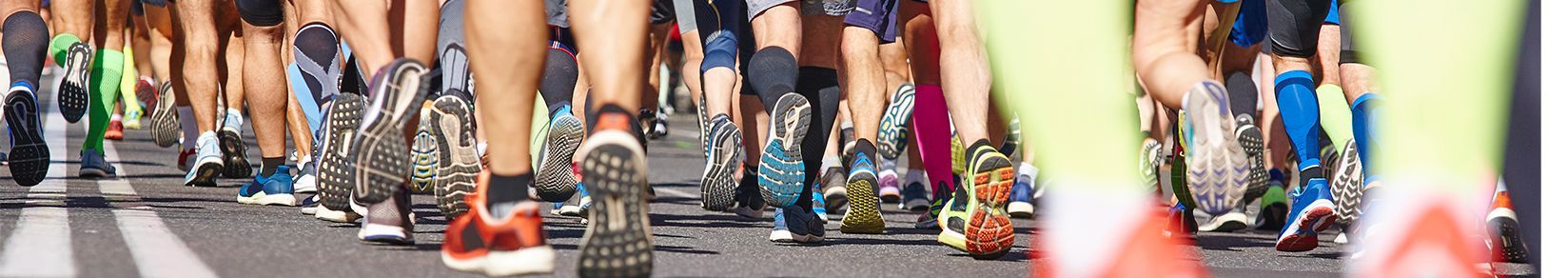 Marathon runners viewed from the ankles-down